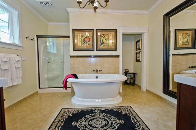 spacious bathroom featuring soaking tub & separate shower