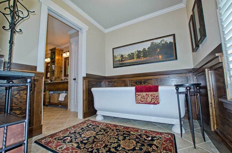 view of bathroom featuring standing bathtub