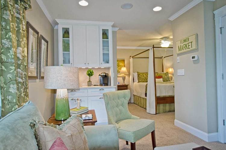 view of queen bed from separated seating area